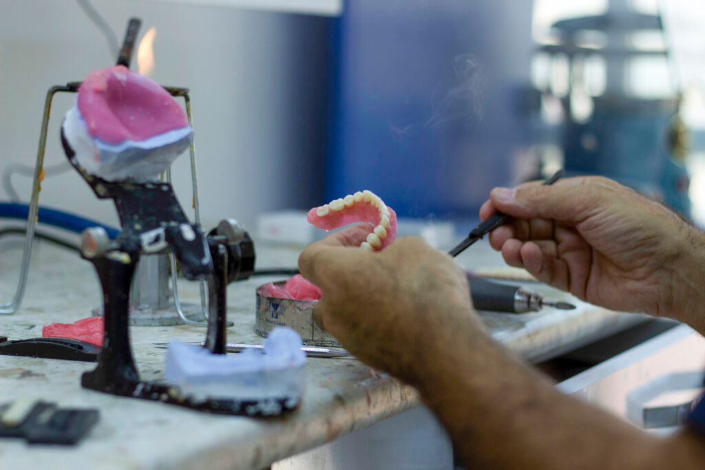 technician creating a denture, mouth reconstruction
