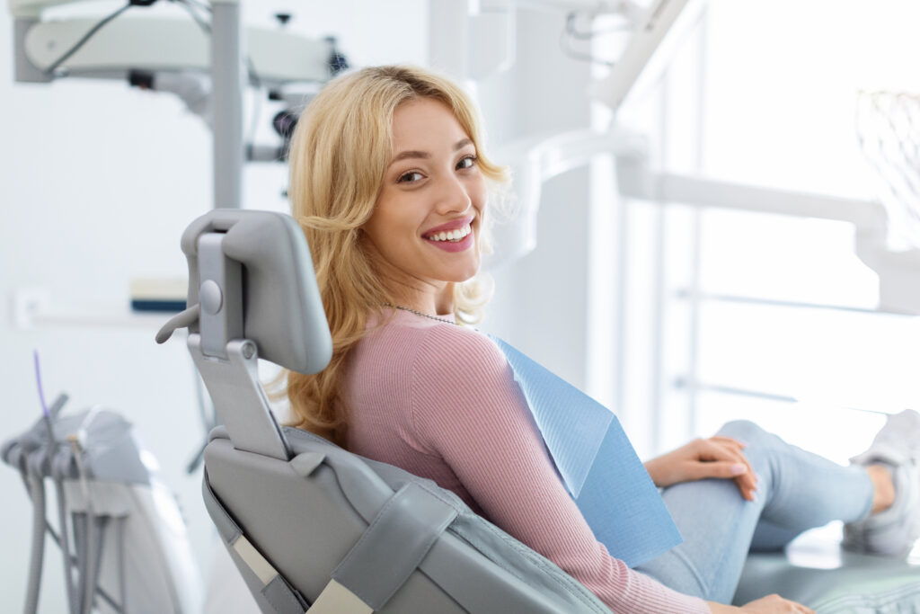 relaxed young woman sitting calmly in a modern dental office