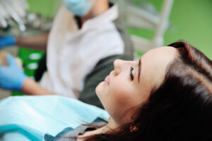 closeup of a young woman in a dental chair, modern dental office